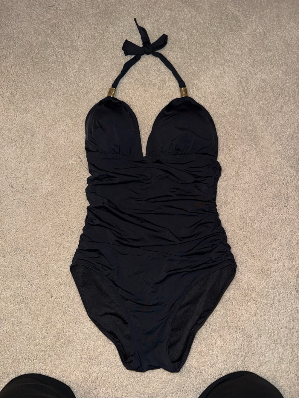 Flattering Black Halter One-Piece Swimsuit with plunging neckline & Gold Accents